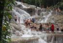 tourists climbing the dunns river fall