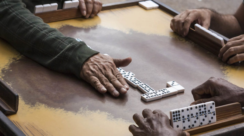 hand showing dominoes